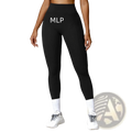 Elite high waisted athletic leggings in black with a sleek form fitting design and subtle side pockets