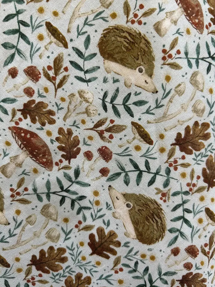 Elizabeth hedgehog print vintage cotton pleated dress in soft cream with woodland pattern of hedgehogs and autumn motifs