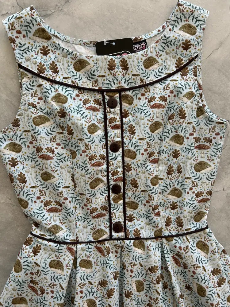 Elizabeth hedgehog print vintage cotton sleeveless dress with brown hedgehogs leaves mushrooms on cream background