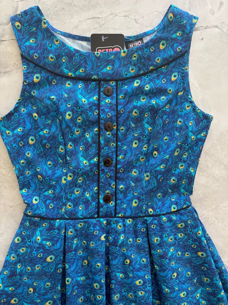 Elizabeth peacock print vintage cotton midi dress in blue with sleeveless design black buttons and trim