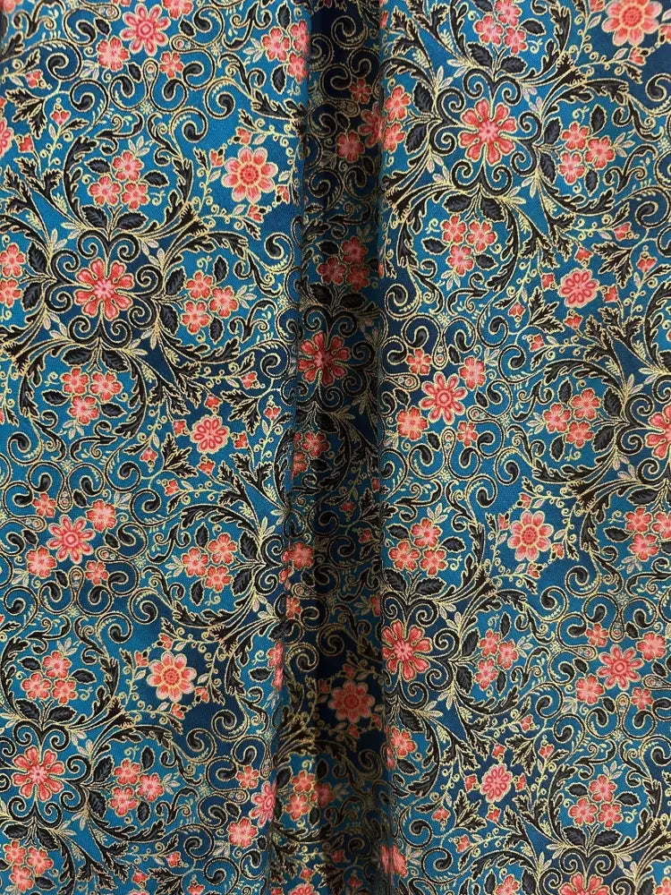 Elizabeth vintage blue floral cotton A-line dress with pockets featuring vibrant pink blossoms black vines and gold accents