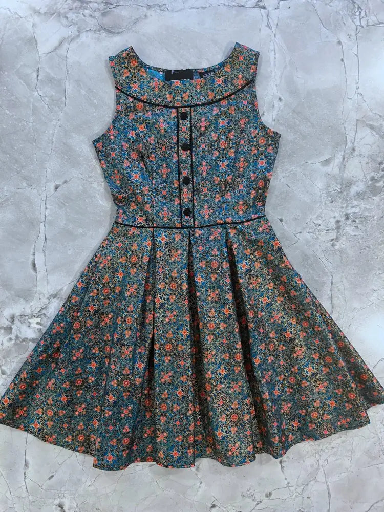 Elizabeth vintage blue floral cotton a-line dress with pockets featuring dark teal base and black trim accents