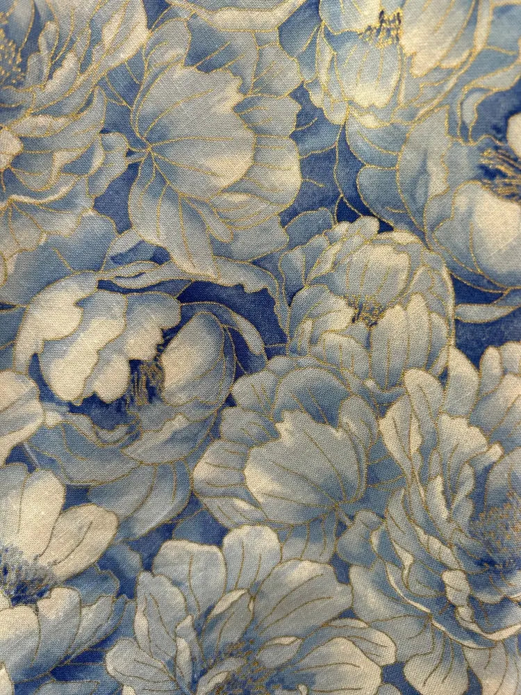 Elizabeth Sky floral vintage cotton pleated dress in blue and white with delicate gold thread outlining the petals