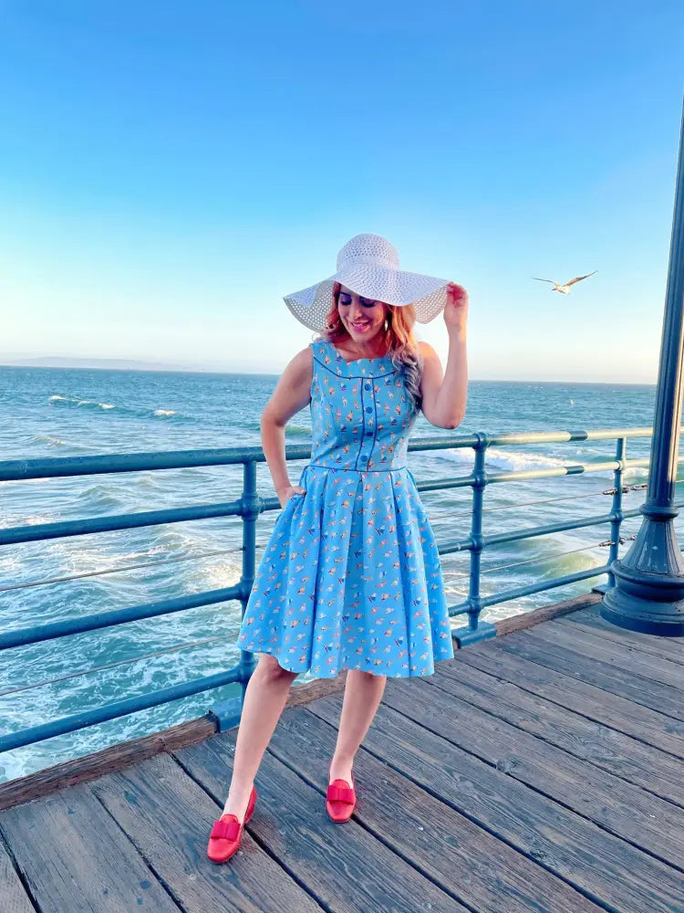 Elizabeth light blue sleeveless vintage cotton A-line dress with floral pattern and button detailing
