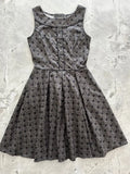 Elizabeth dress sleeveless dark gray damask cotton midi with subtle geometric pattern and fitted bodice button details