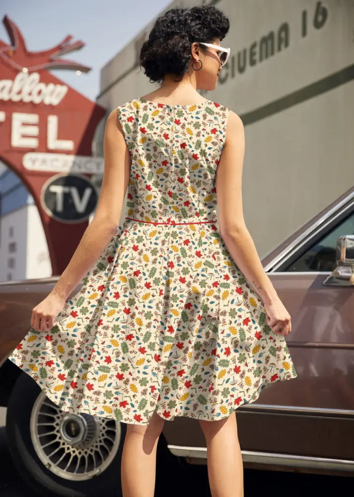 Elizabeth woodlands vintage sleeveless flared cotton dress in cream with vibrant red green and yellow leaf pattern and pockets