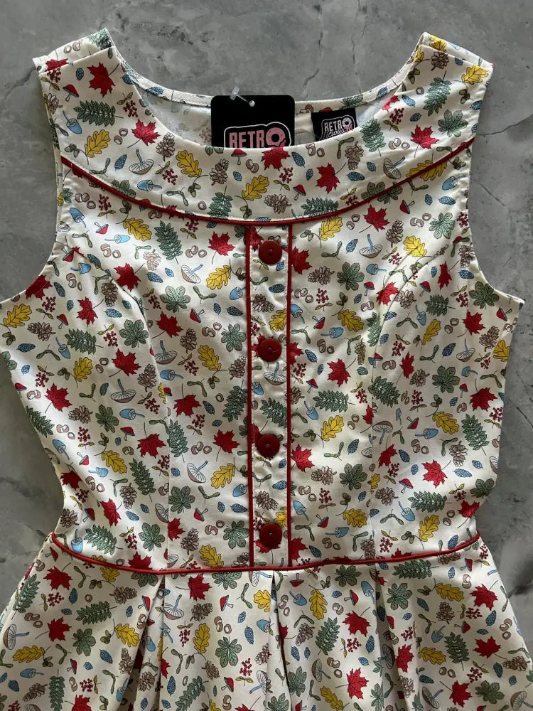 Elizabeth woodlands vintage cotton floral sleeveless cream dress with autumn leaf print pockets and red stitching accents