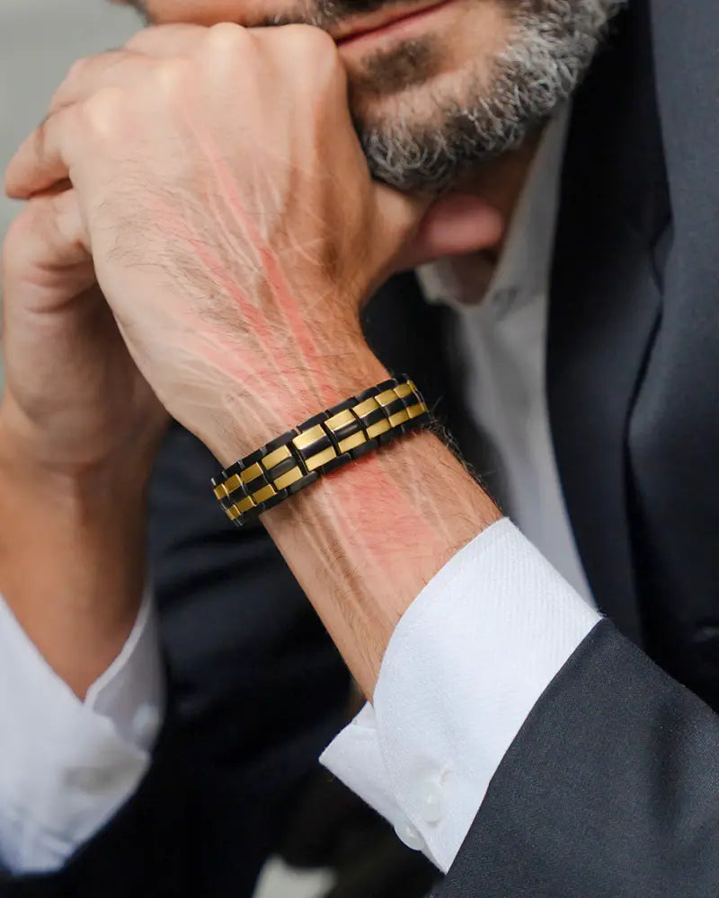 Ellipsemax titanium 5000 gauss magnetic bracelet for men in sleek black and gold segmented design worn on wrist