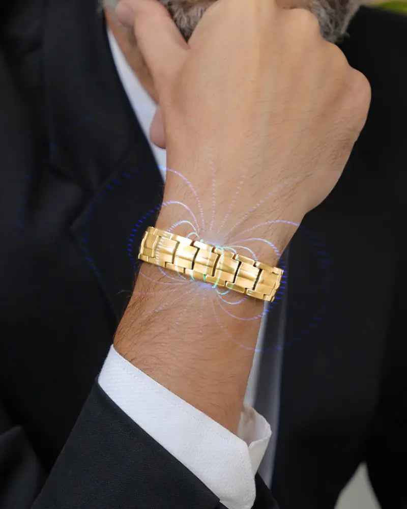 Gold-toned metal link ellipsemax gold titanium 5000 gauss magnetic bracelet worn on wrist
