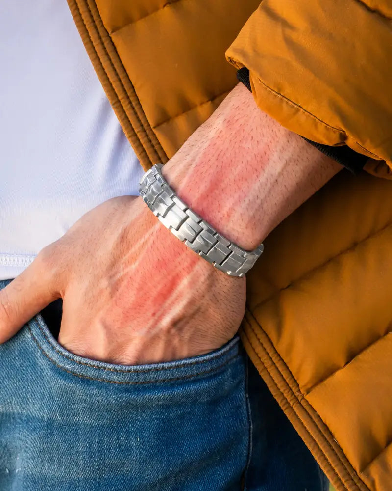 Ellipsemax silver titanium magnetic link bracelet in silver tone worn on wrist for men