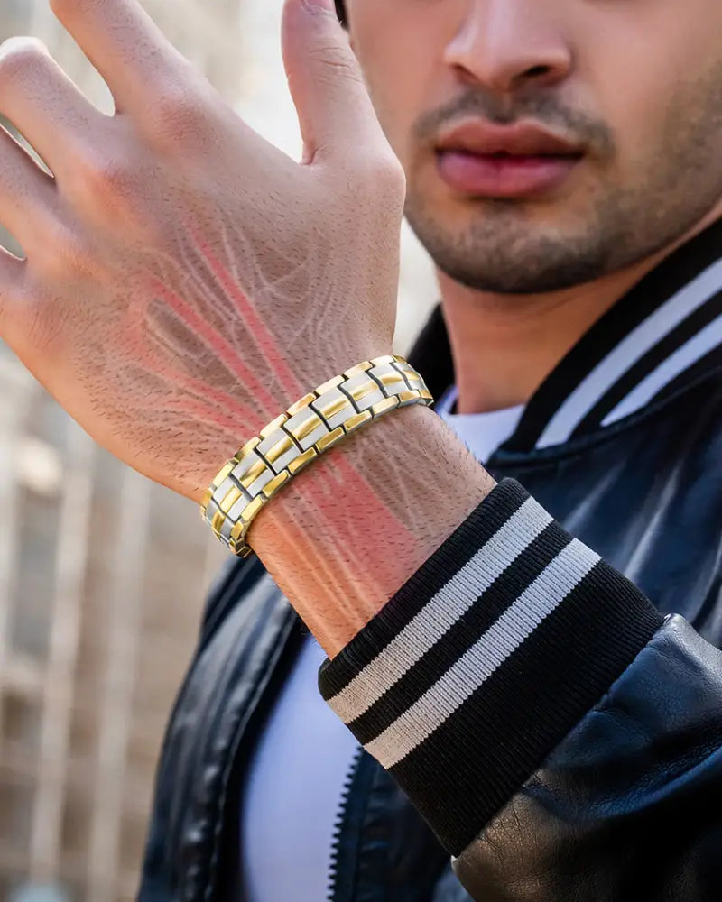 Ellipsemax titanium 5000 gauss two tone magnetic bracelet in gold tone metal with sleek interlocking link design on wrist