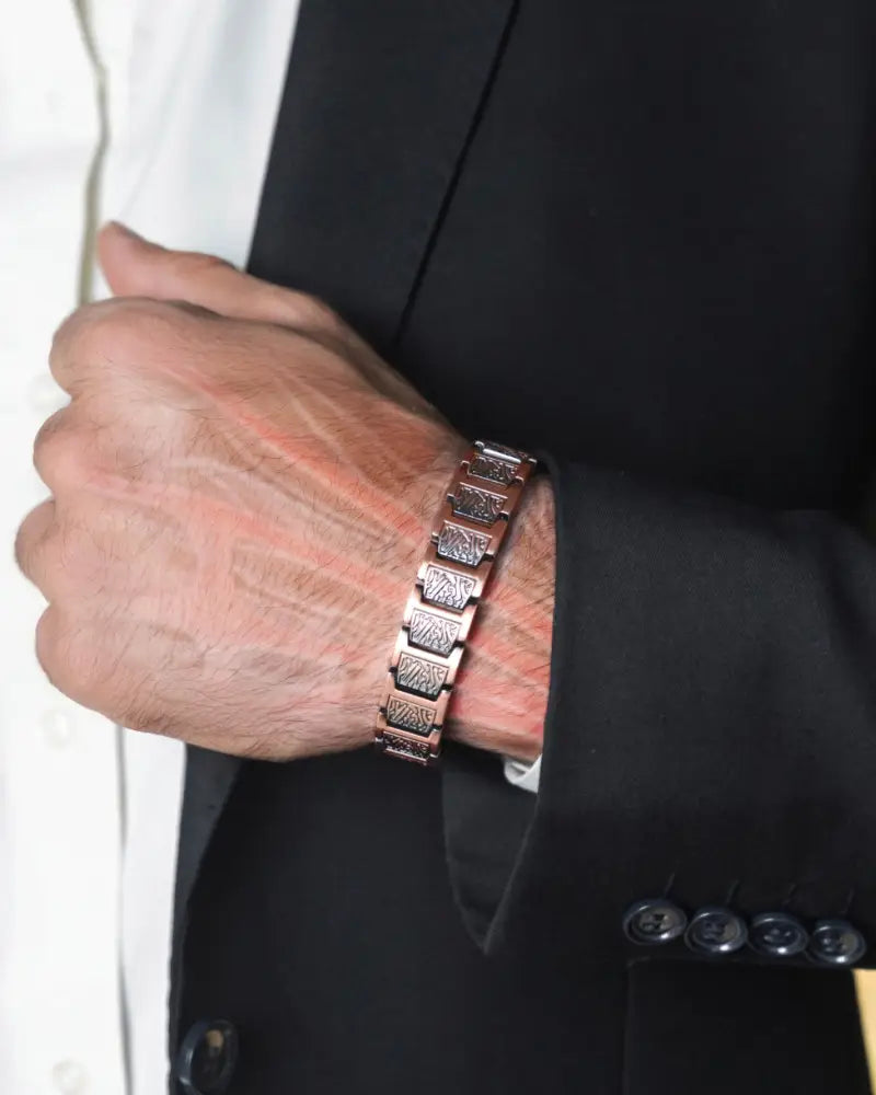 Ellipsemax Viking rose gold magnetic copper bracelet for men with textured rectangular links on a man’s wrist