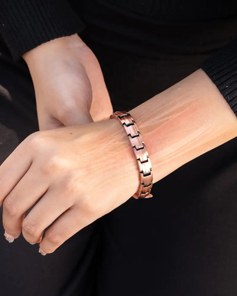 Ellipsemax magnetic rose gold copper therapy bracelet with sleek interlocking link design worn on a wrist