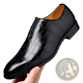 Black crocodile-embossed leather slip-on men’s dress shoe with polished finish and tan interior lining