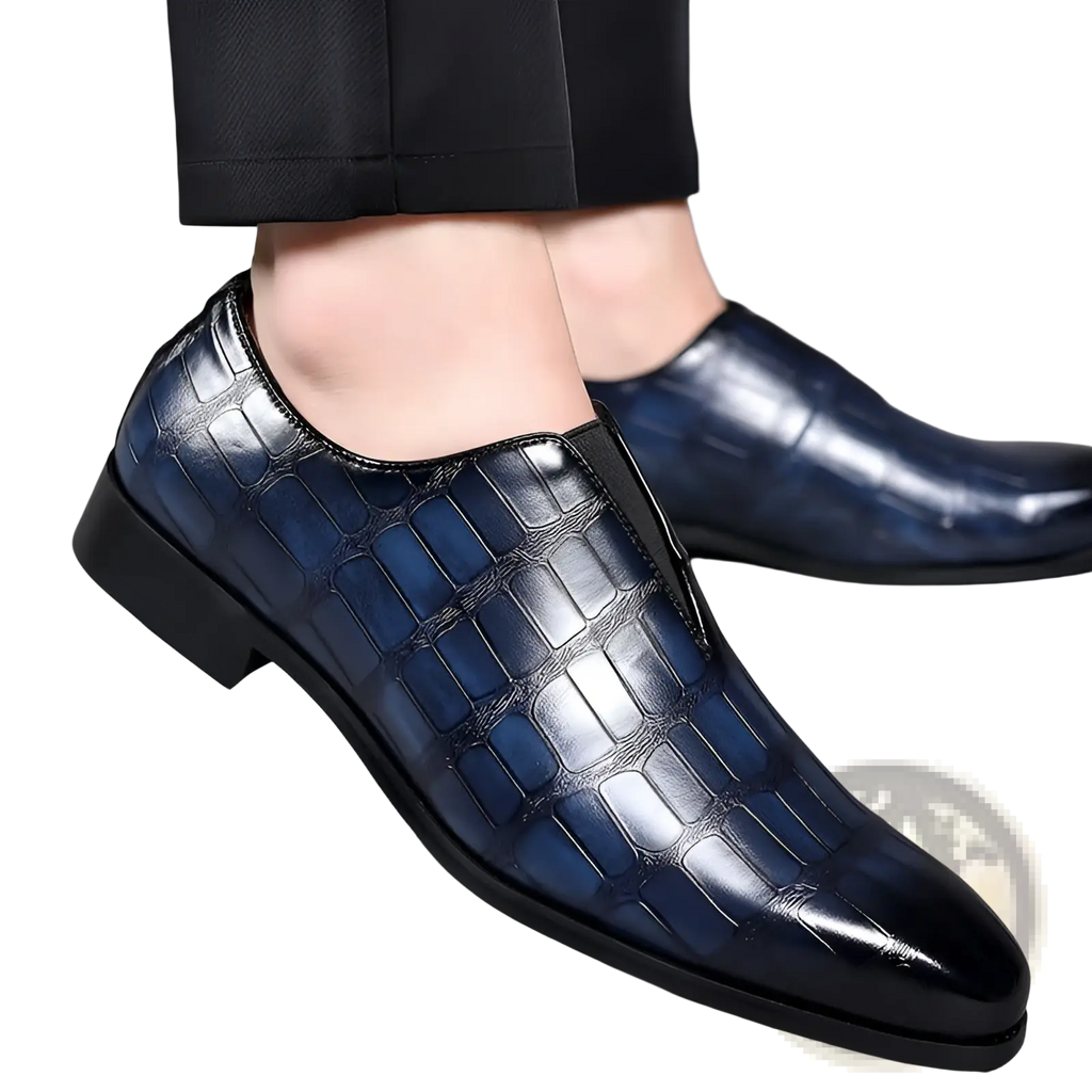 Embossed stone pattern slip on leather loafers in dark blue crocodile leather with polished finish and black rubber soles