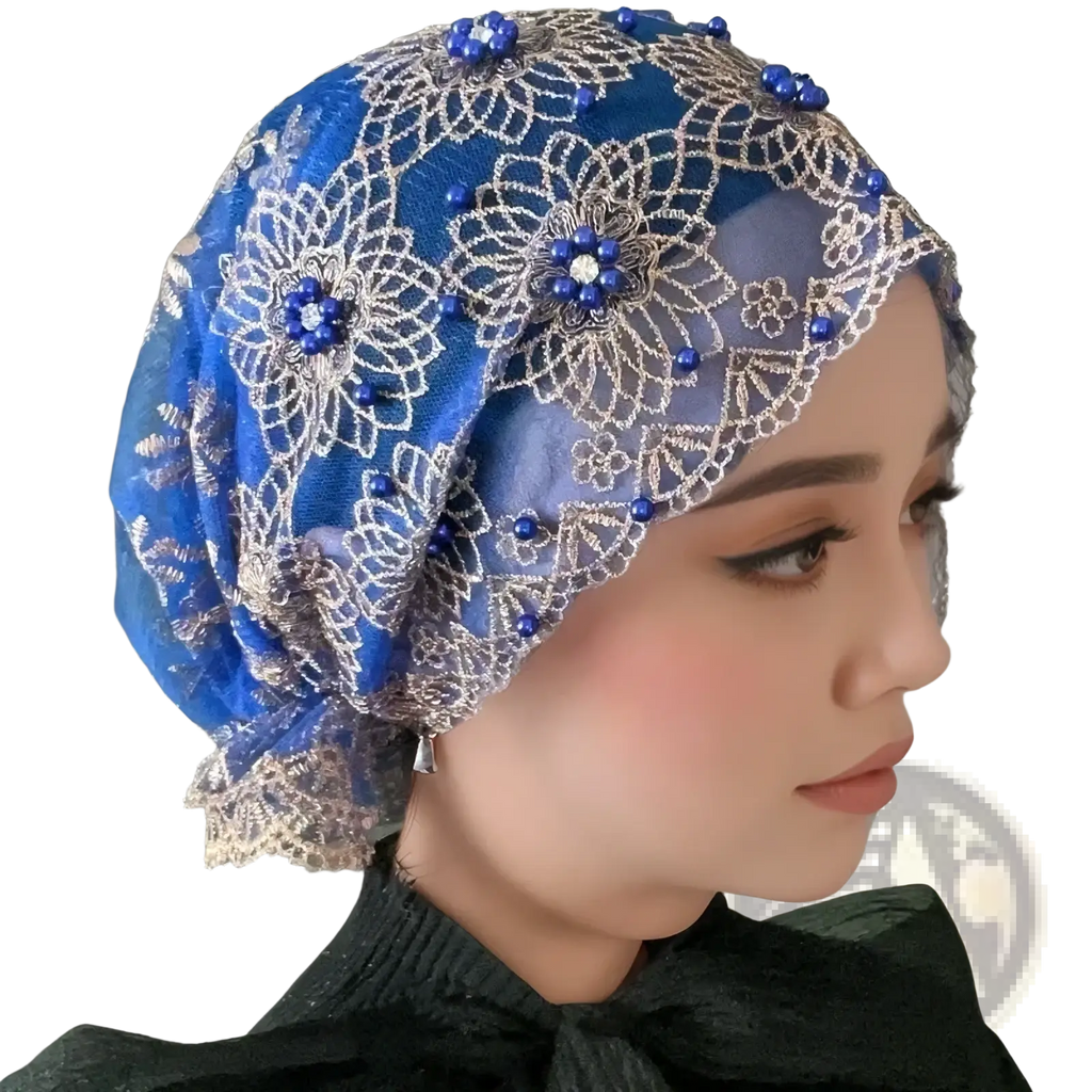 A vibrant royal blue embroidered beaded lace hijab hat with intricate silver lace and deep blue floral bead patterns