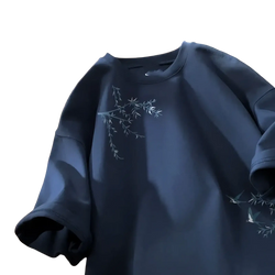 Navy blue cotton embroidered bird oversized t-shirt with delicate white branches and leaves on the chest