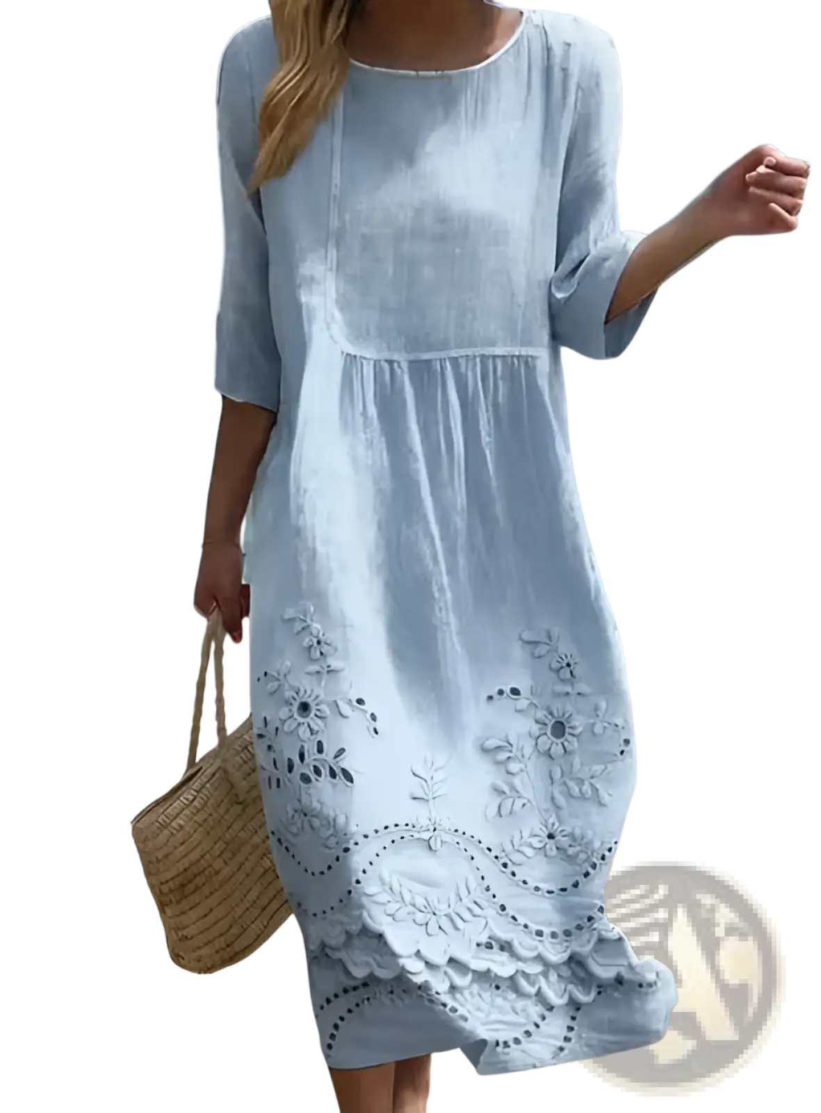 A light blue embroidered blue linen floral scalloped umbrella dress with delicate white floral embroidery and flowing fabric