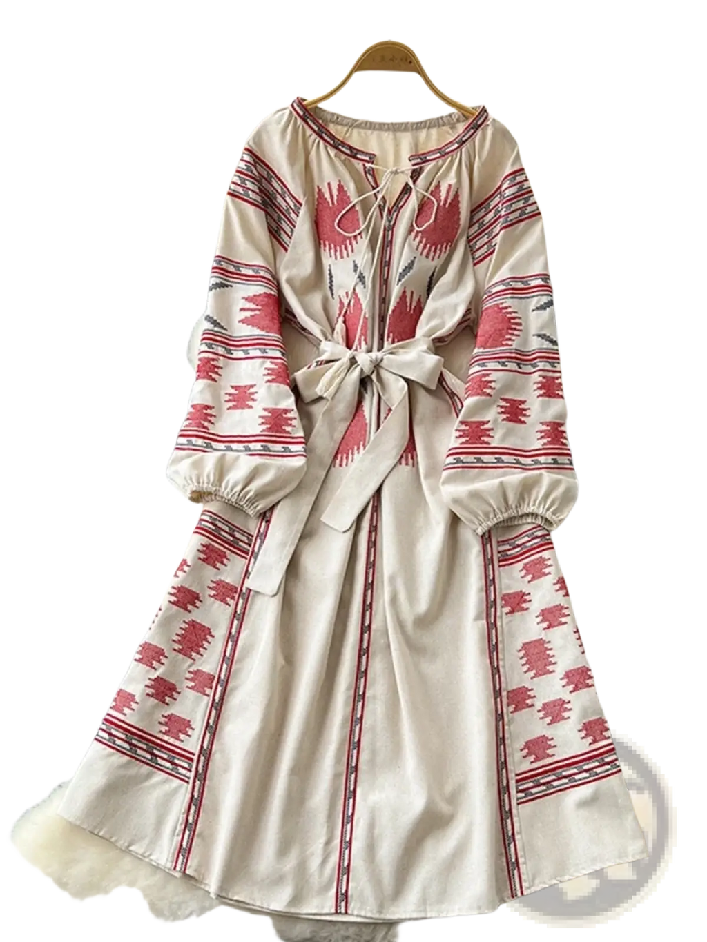 A cream-colored embroidered boho midi dress with intricate red embroidery and a tied waistband in beige