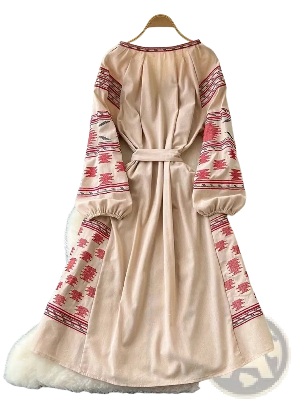 Beige long sleeve boho midi dress with red geometric embroidery and belted waist in an a-line silhouette