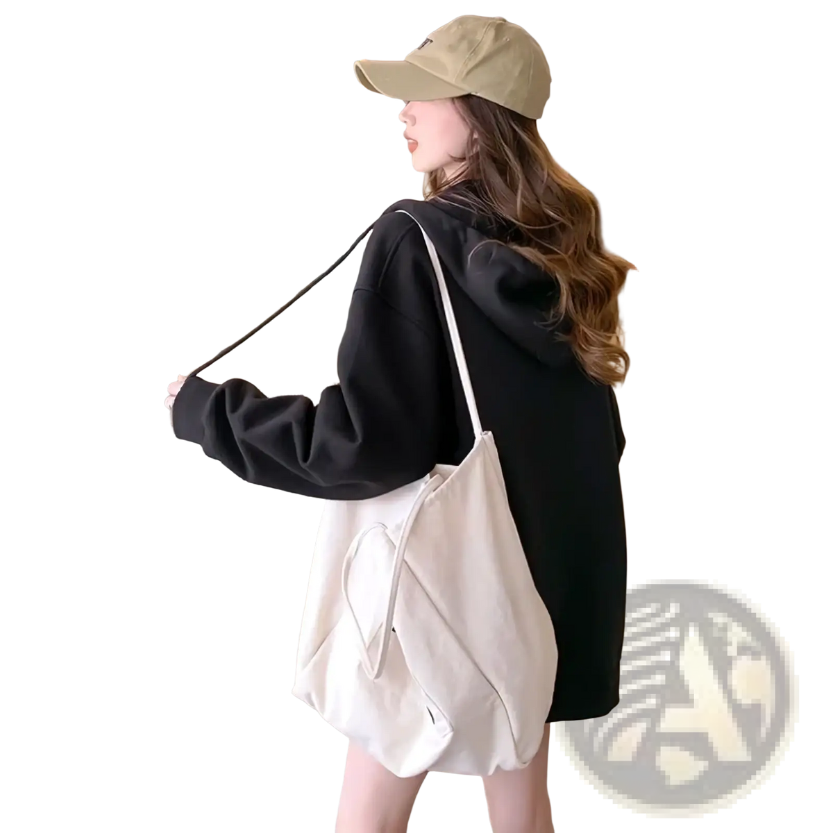 A soft off-white canvas tote bag with a drawstring closure and slender shoulder strap shown with an embroidered bunny zip up hoodie