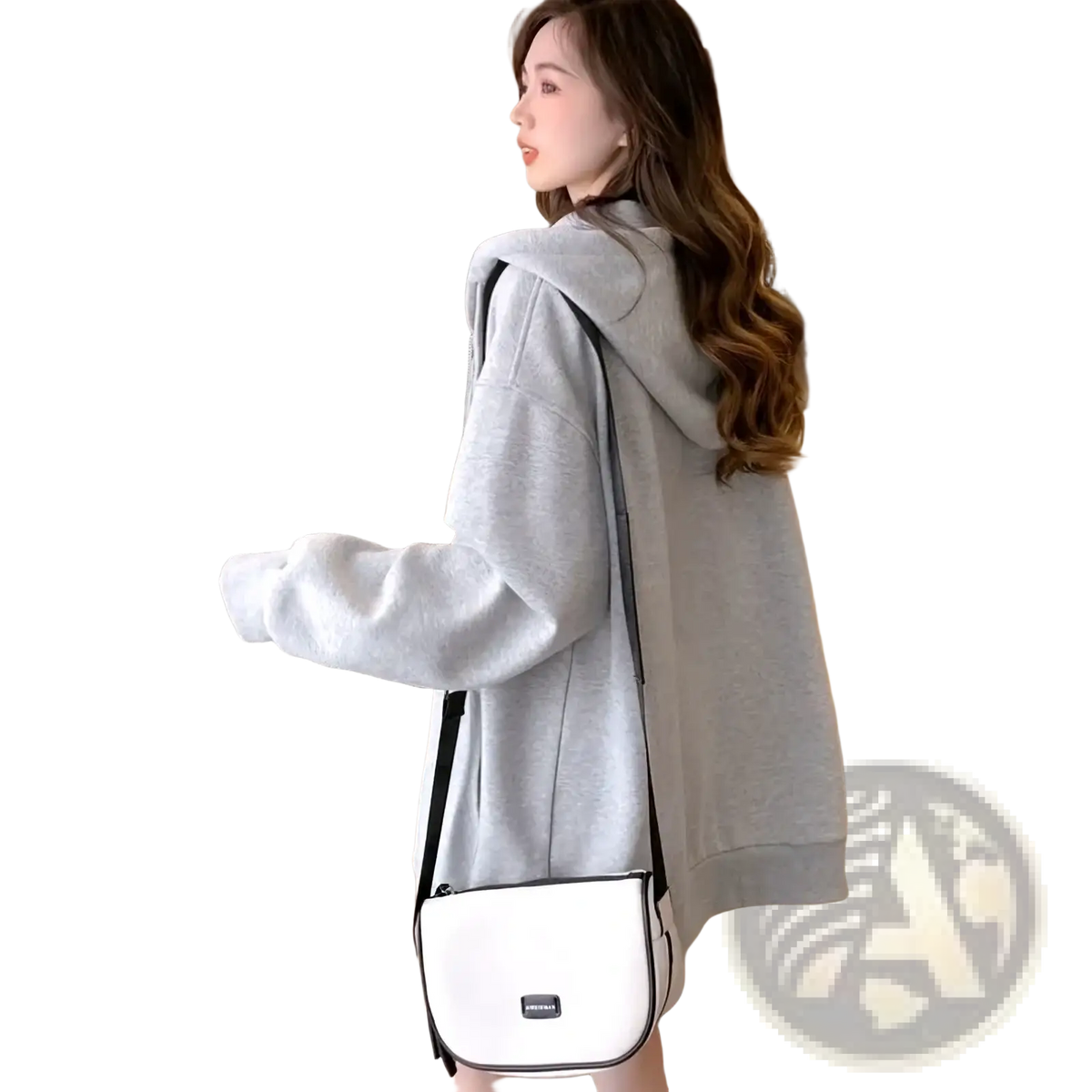 White crossbody bag with black trim and small rectangular logo plaque paired with embroidered bunny zip up hoodie