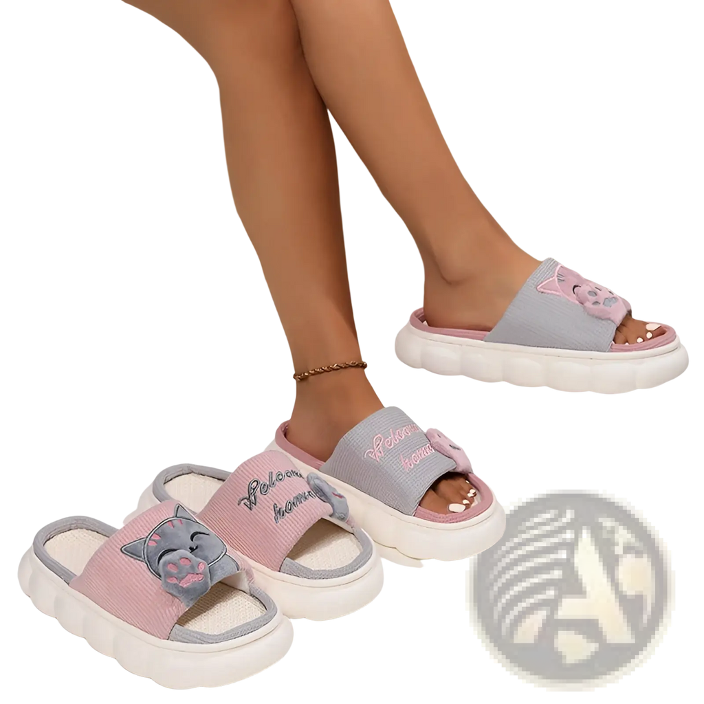 Pink and gray cat-themed slide sandals with textured fabric upper, embroidered welcome home text, and chunky white soles