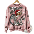 A fluffy pink embroidered Christmas cat fuzzy sweater with a tabby cat in a Santa hat surrounded by festive details