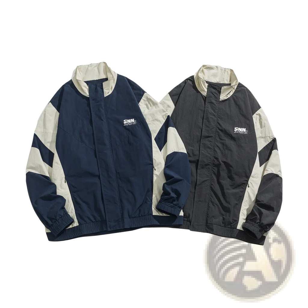 Two embroidered color block loose windbreaker jackets in navy blue cream and black cream with white logo patches on chest