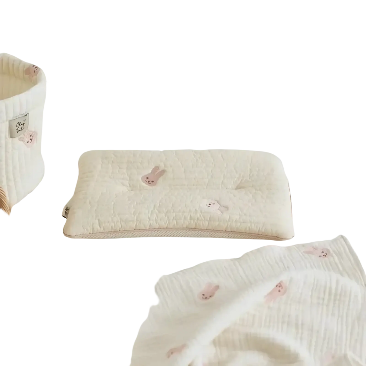 Cream-colored quilted embroidered cotton baby pillow with soft pink bunny appliqués for infant comfort