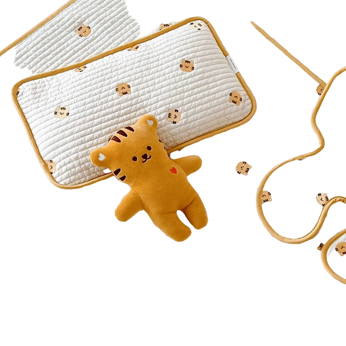Yellow plush tiger toy with red embroidered heart on chest featured on embroidered cotton baby pillow