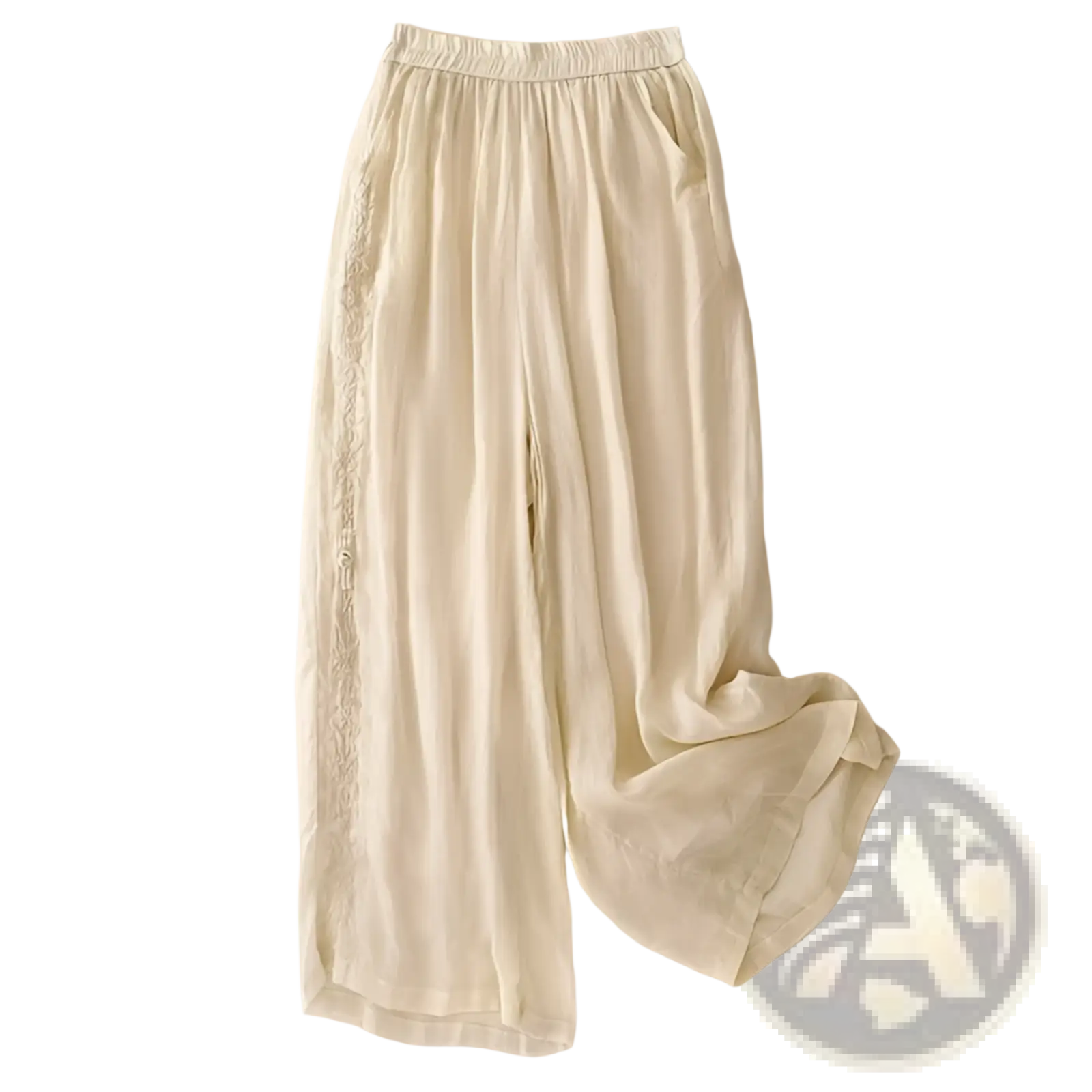 Cream-colored embroidered cotton linen wide leg pants with lightweight fabric and delicate lace trim along side seams