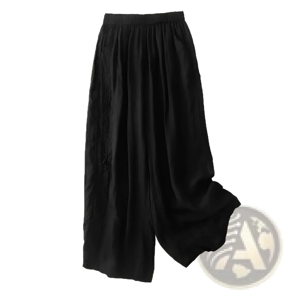 Black embroidered cotton linen wide leg pants with subtle side embroidery and elastic waistband for comfortable wear