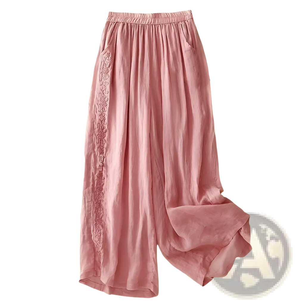 Soft pink embroidered cotton linen wide leg pants with delicate floral embroidery along the side seam