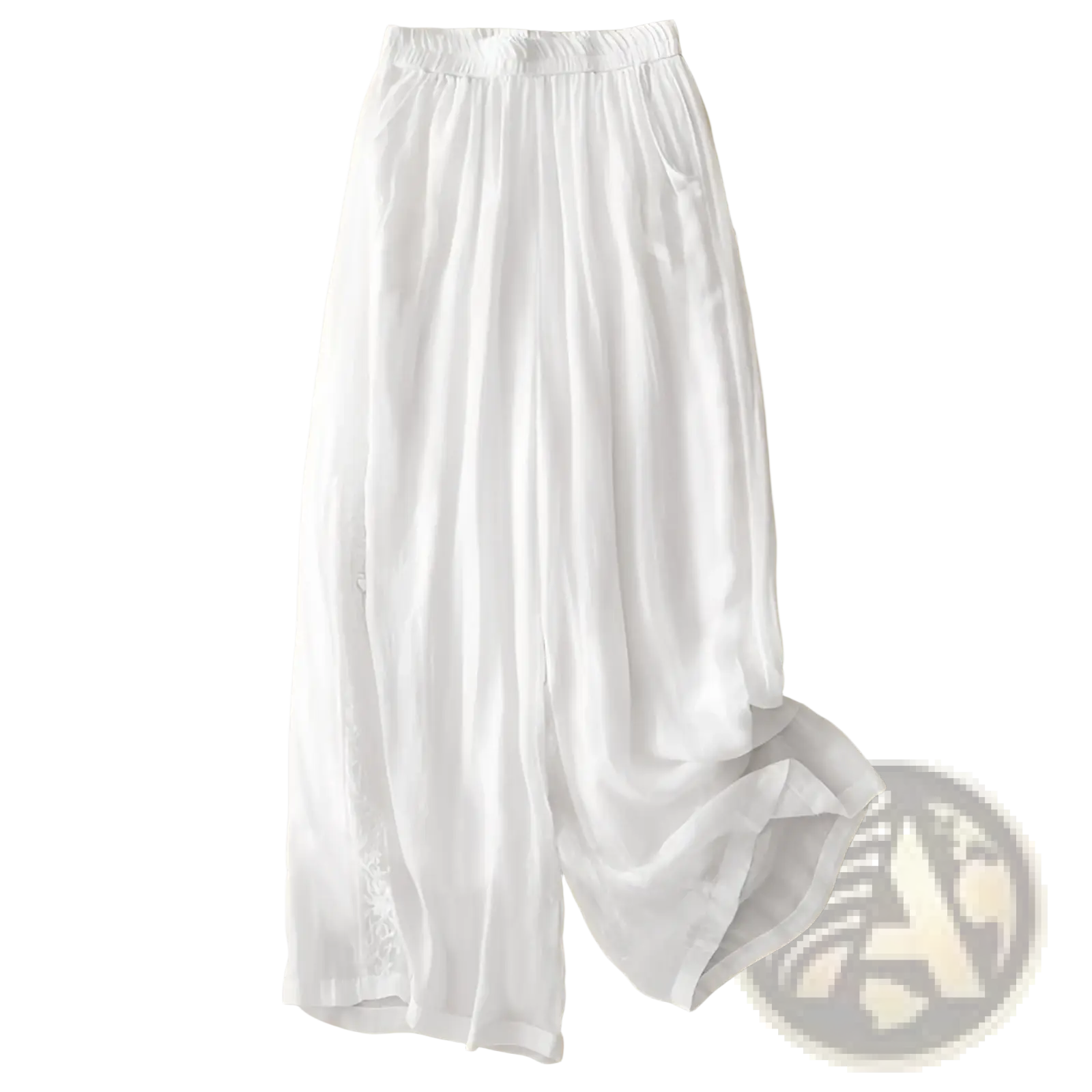 White embroidered cotton linen wide leg pants with elastic waistband and subtle side embroidery visible from the front