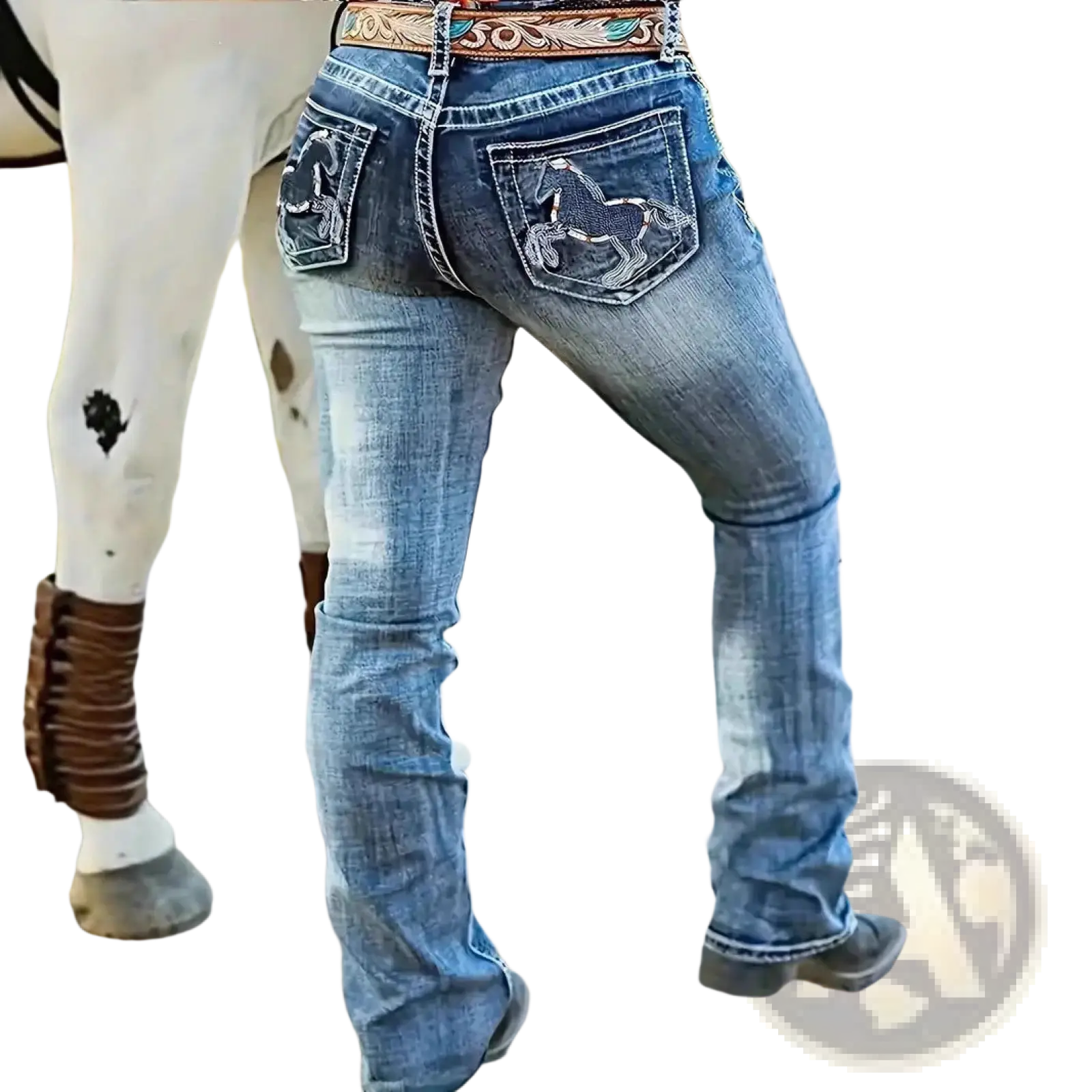 Back side of blue denim straight leg jeans with embroidered horse designs on pockets and floral decorative belt