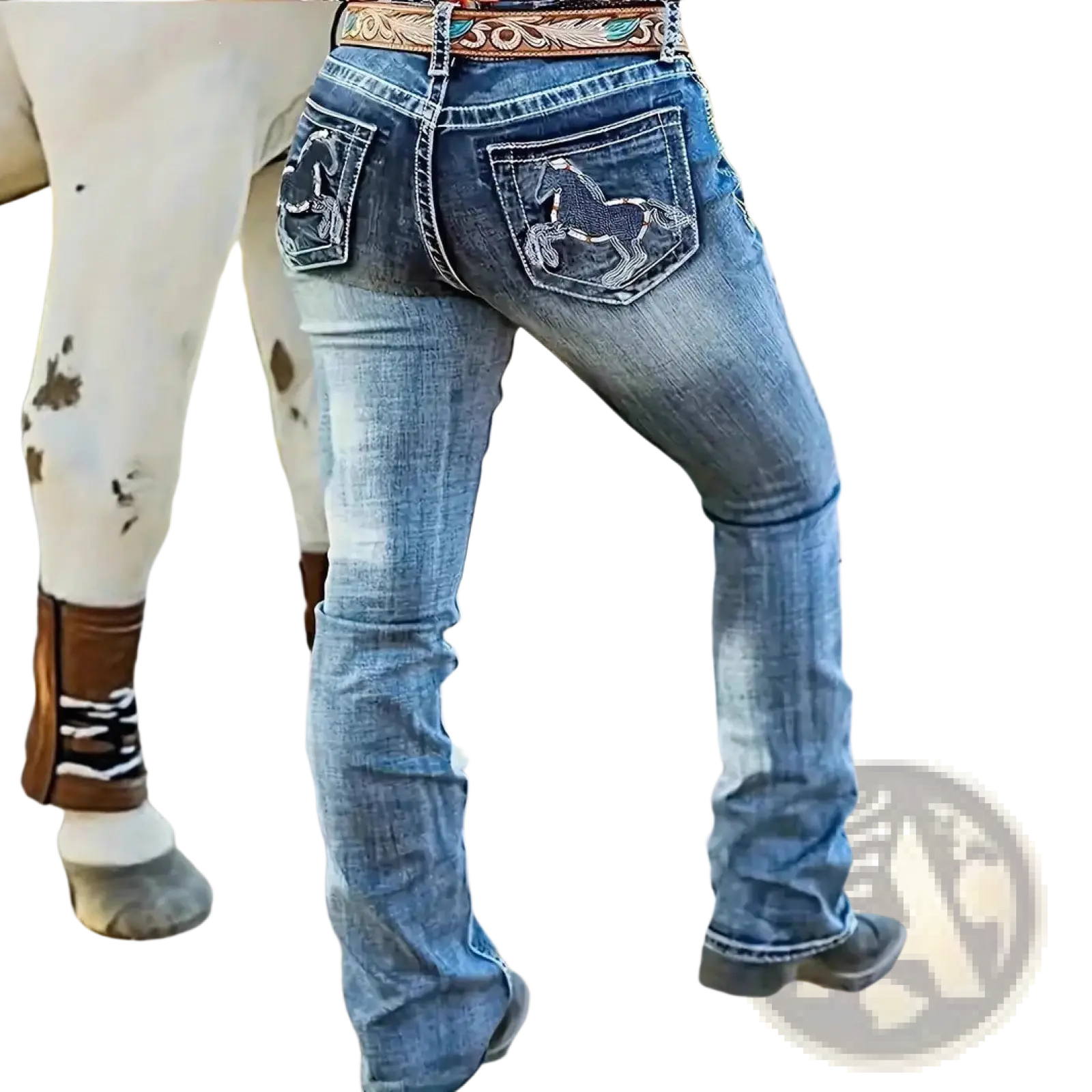 Back side of blue embroidered denim straight leg jeans with horse designs on pockets and decorative belt