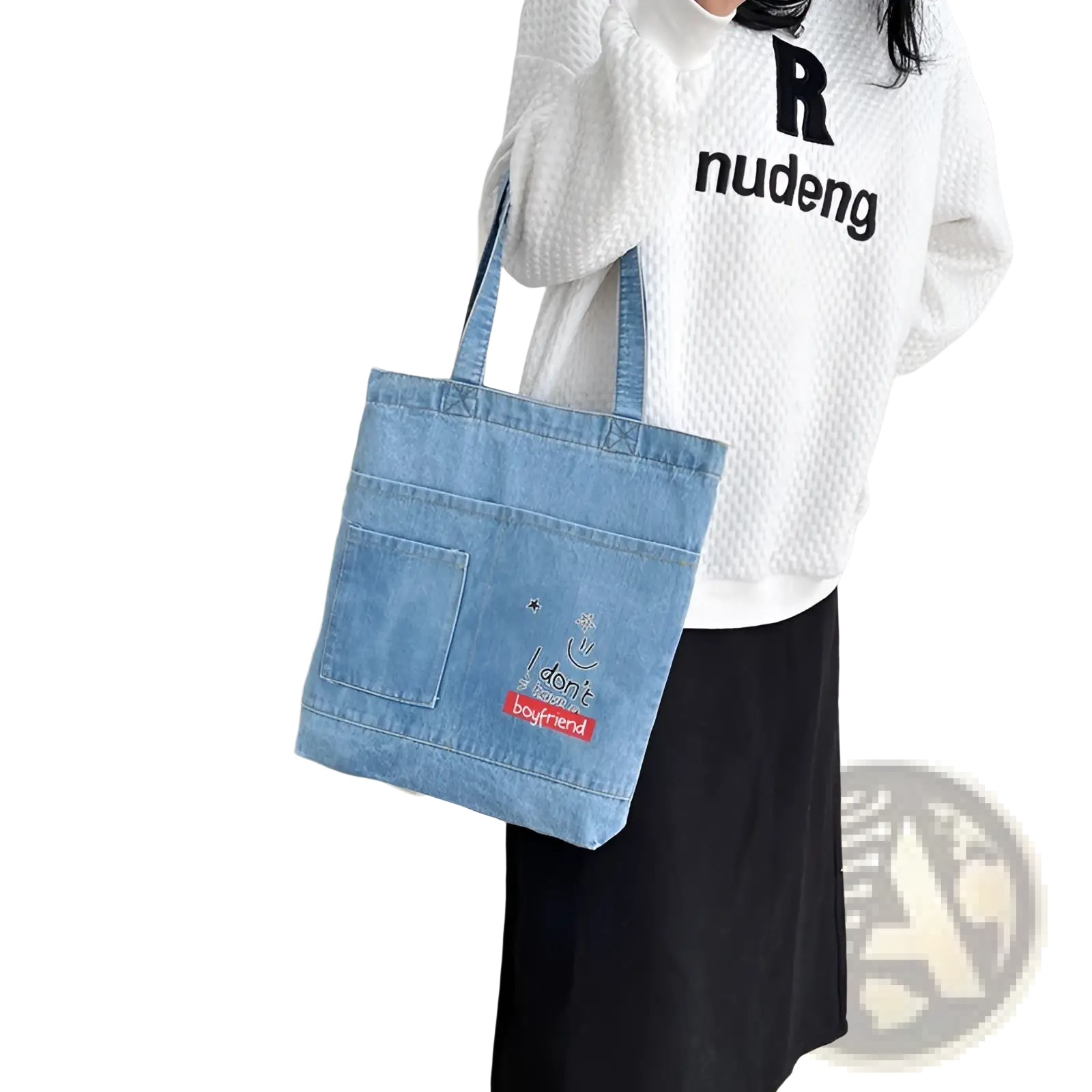 Blue denim tote bag with embroidered text and red rectangular patch featuring a soft handle for easy carrying