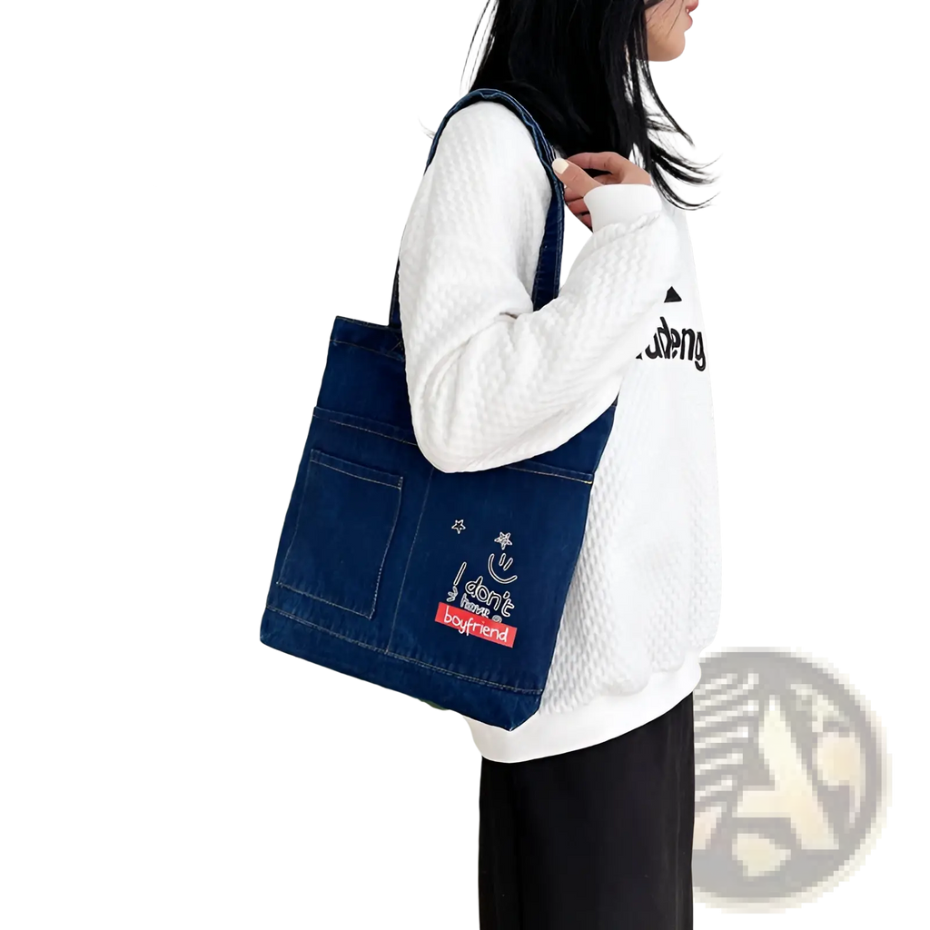 Blue denim tote bag with soft handle featuring embroidered patch with slogan i dont need a boyfriend and designs