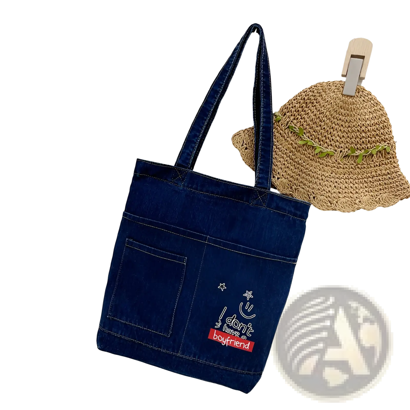 A navy blue denim tote bag with front pocket and white embroidered text i don’t have a boyfriend with star accents