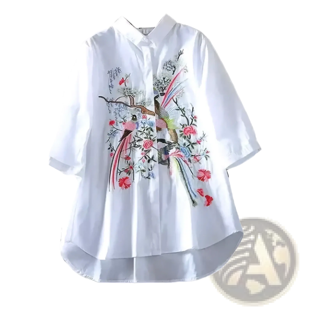 White chiffon blouse with intricate colorful bird and flower embroidery on front for elegant floral style
