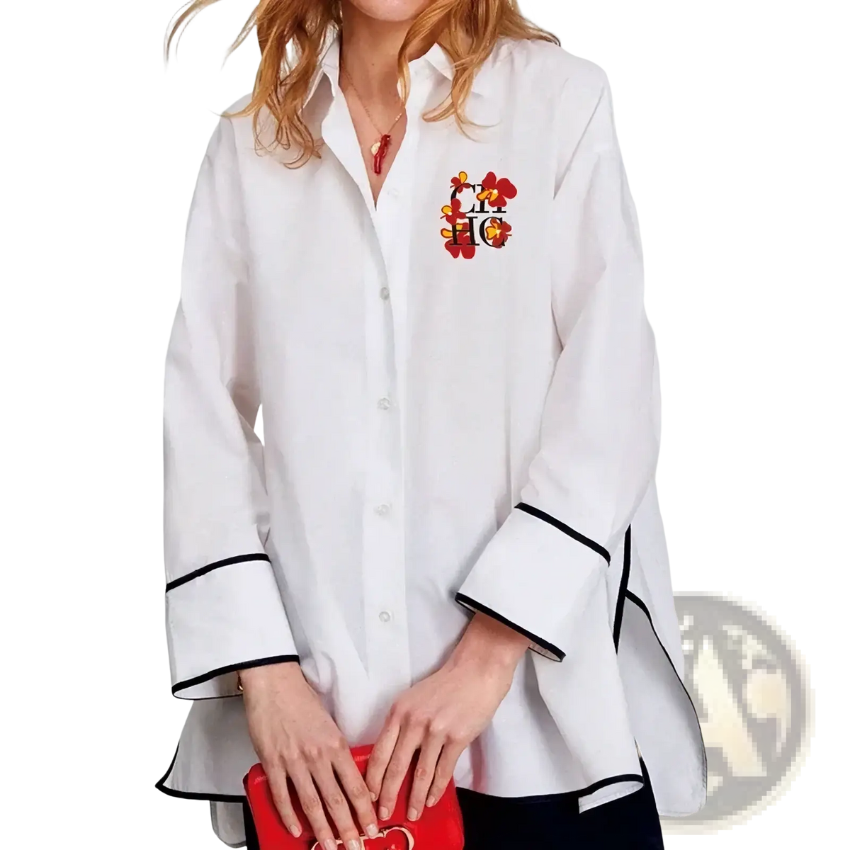 White cotton button up blouse with black trim on cuffs and hem and colorful floral embroidery on left chest