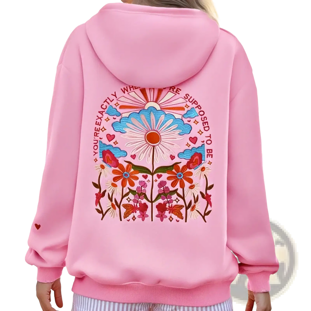 Pink loose casual sweatshirt hoodie with colorful embroidered floral design and inspirational phrase on the front