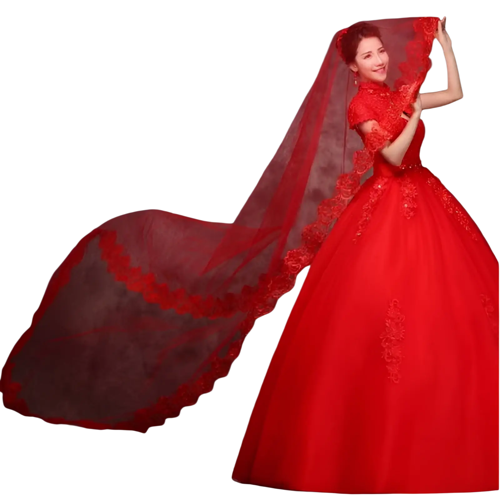 A flowing red lace cathedral wedding veil with intricate floral embroidery worn over a matching red gown