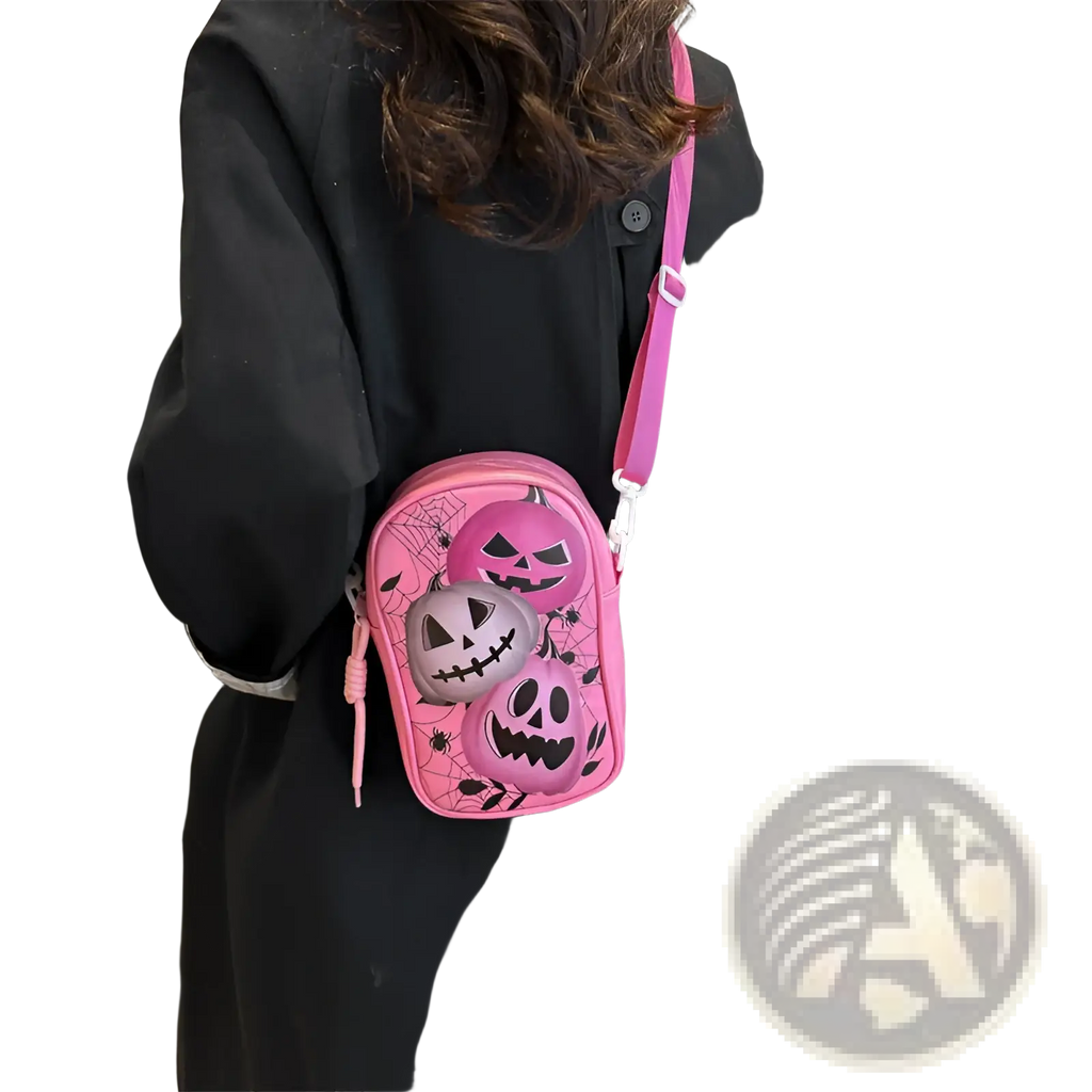 Pink embroidered Halloween floral and pumpkin crossbody bag featuring jack-o-lanterns and spiderweb design