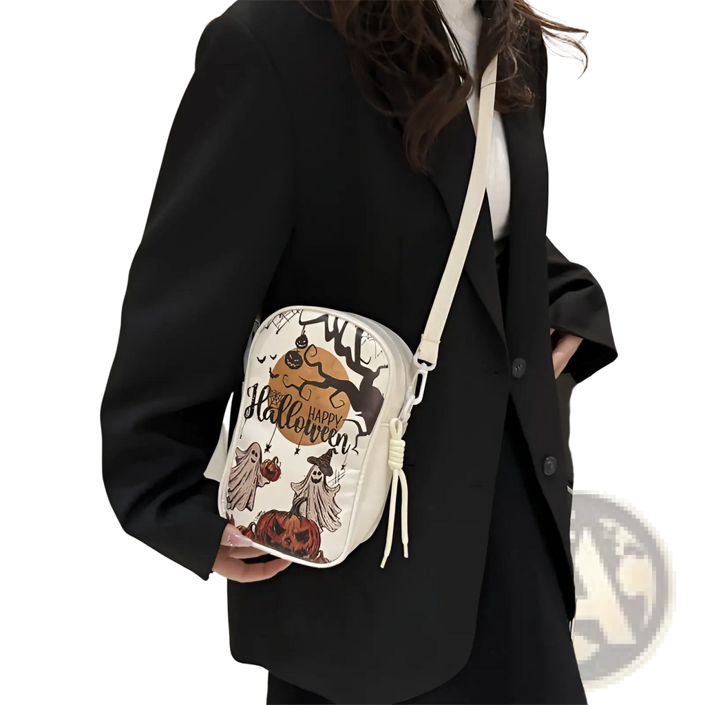White embroidered Halloween floral and pumpkin crossbody bag with black and orange ghosts pumpkins and witch illustrations