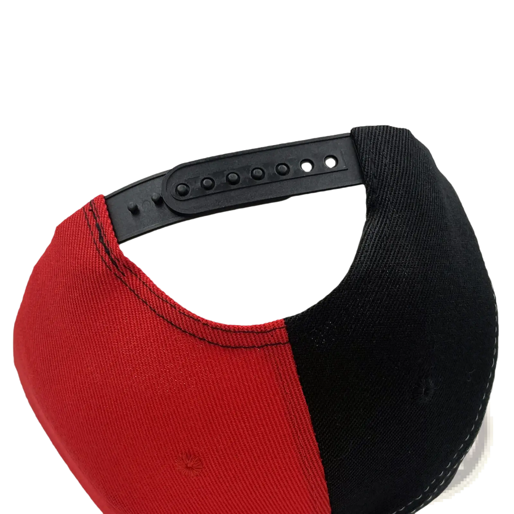 Red and black two-tone embroidered hip hop snapback cap with black plastic adjustable strap shown from the back side
