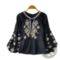 Black embroidered lantern sleeve blouse with intricate gold blue and white geometric patterns and tie front tassels