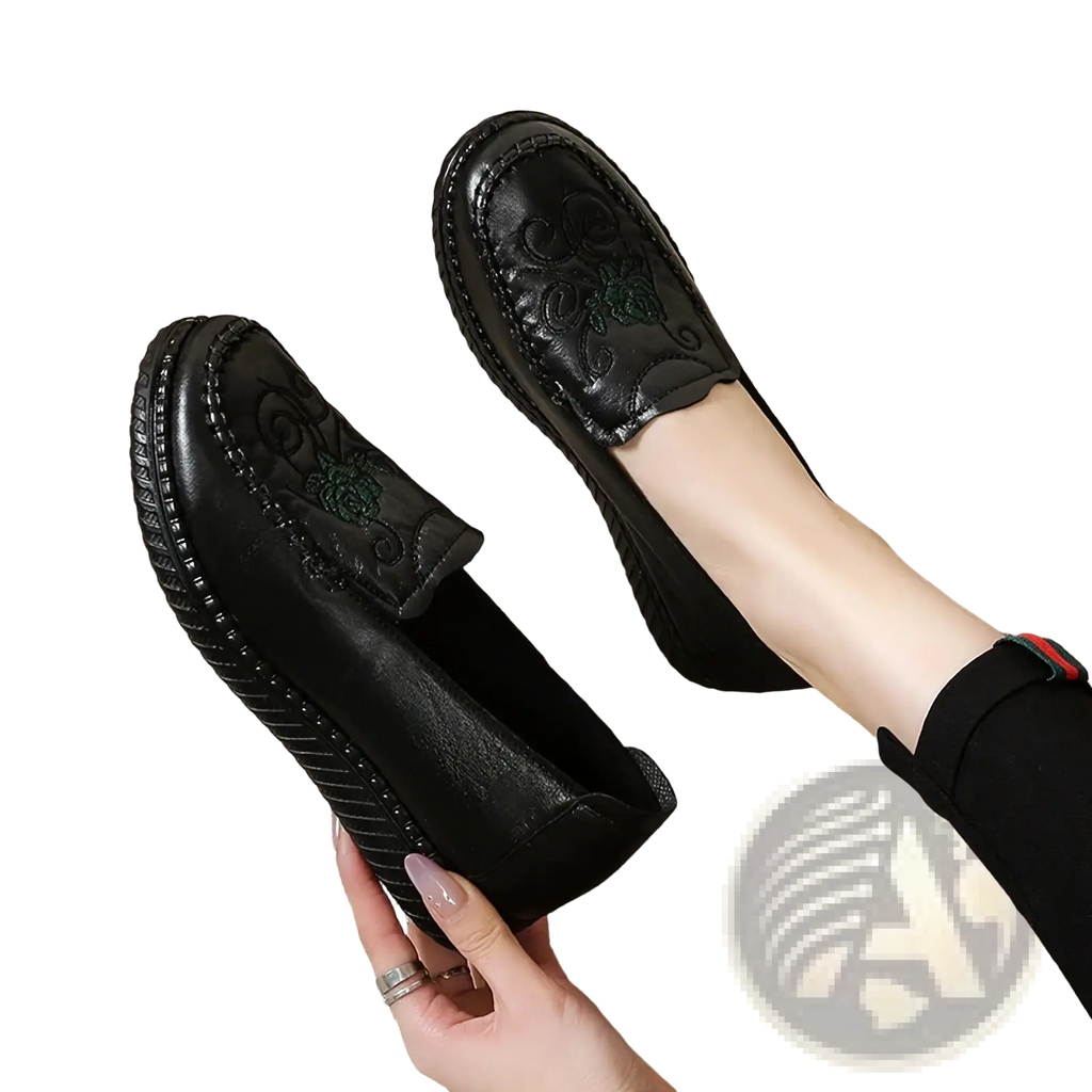 Black leather embroidered slip on loafers with green floral embroidery on the side for stylish wear