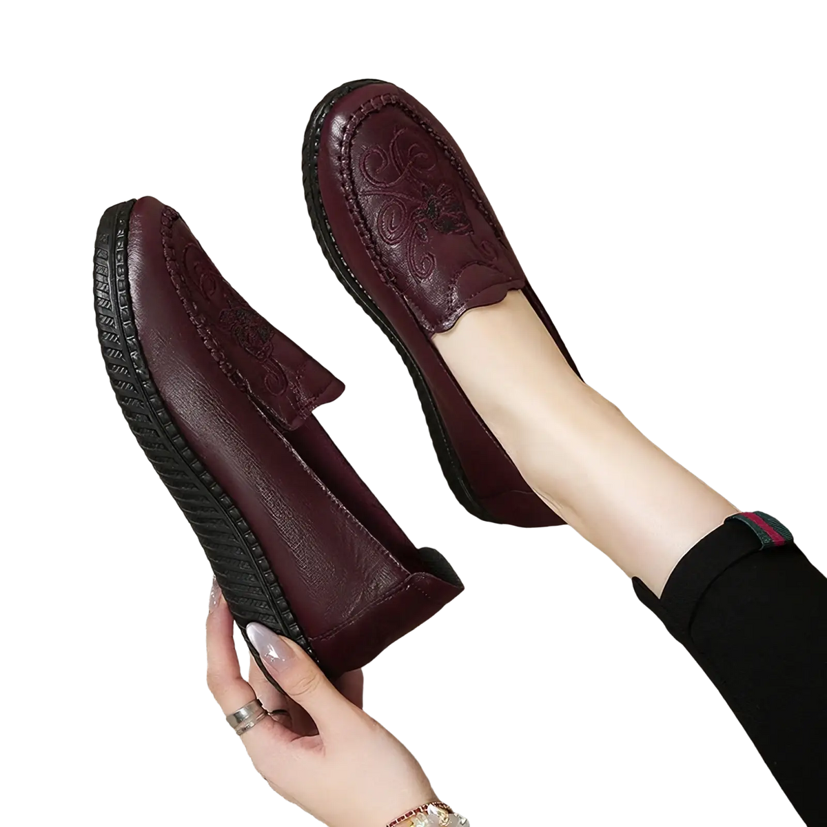 Burgundy embroidered leather slip on loafers with floral patterns and textured black rubber sole